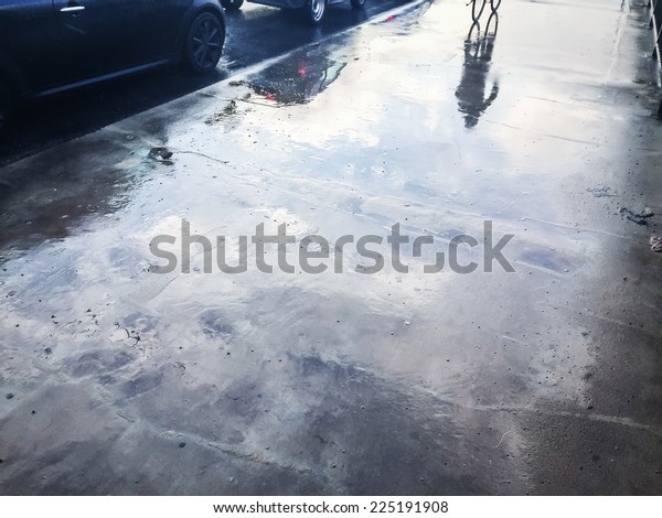 Wet street with\
reflections
