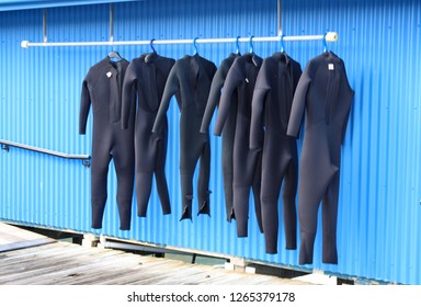 Wet Suit Bar On Blue Wall Background