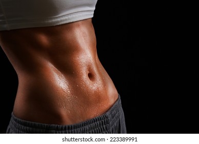 Wet torso of young sporty woman