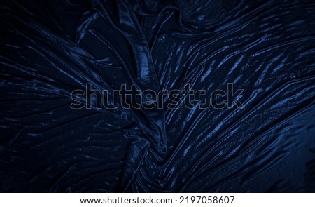 Wet velvet fabric making abstract blue banner background.