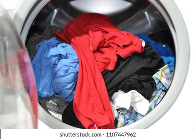 Wet Washed Laundry In Washing Machine With The Door Open, Closeup