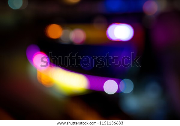 A wet window with background of the lights of the\
night city