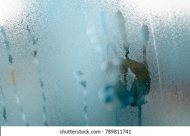 Wet Window Glass With Hand Shape Print On Natural Abstract Background. Close Up Picture Textured Foggy Surface