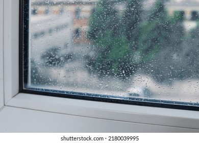 Wet Window On Rainy Day, Closeup. View From Inside