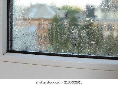 Wet Window On Rainy Day, Closeup. View From Inside