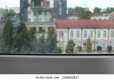 Wet Window On Rainy Day, Closeup. View From Inside