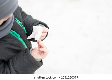 Wet Wipes In The Child's Hands In Winter