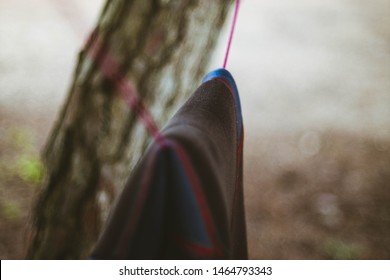 Wetsuit Hanging In A Rope 