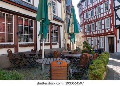 Wetzlar, Hessen, Germany - 06.03.2021: Empty Restaurant Outdoors Chairs Stacked Up During Corona Pandemic Covid-19 Businesses Empty Streets No Business Crisis, Lockdown New Normal Economy