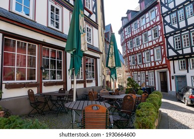 Wetzlar, Hessen, Germany - 06.03.2021: Empty Restaurant Outdoors Chairs Stacked Up During Corona Pandemic Covid-19 Businesses Empty Streets No Business Crisis, Lockdown New Normal Economy