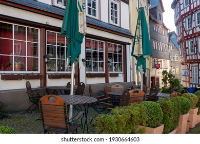 Wetzlar, Hessen, Germany - 06.03.2021: Empty Restaurant Outdoors Chairs Stacked Up During Corona Pandemic Covid-19 Businesses Empty Streets No Business Crisis, Lockdown New Normal Economy