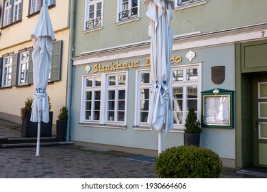 Wetzlar, Hessen, Germany - 06.03.2021: Empty Restaurant Outdoors Chairs Stacked Up During Corona Pandemic Covid-19 Businesses Empty Streets No Business Crisis, Lockdown New Normal Economy