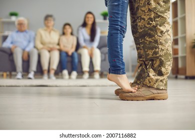 We've Been Waiting For You, Daddy. Veteran Soldier Comes Back Home From The Military. Closeup Close Up Crop Of Father's And Child's Feet Against Blurred Copyspace Background Of Living Room And Family