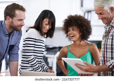 Weve Done A Great Job, Team. Shot Of A Team Of Design Professionals Working Together In An Office.