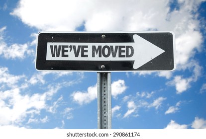 We've Moved direction sign with sky background