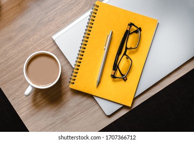 WFH - Work from Home Flatlay Photo of Desk with Laptop, Notepad, Glasses and Cup of Tea