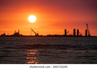 A Wharf Under Construction Along The Coast. Silhouette Of The Dusk Pier Construction. Tiwan