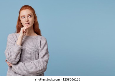 What If I Call Him, Write, Buy It? A Red-haired Mysterious Young Woman Looks To The Side On Empty Copy Space Holding Her Hand On Her Chin, Her Mouth Slightly Open