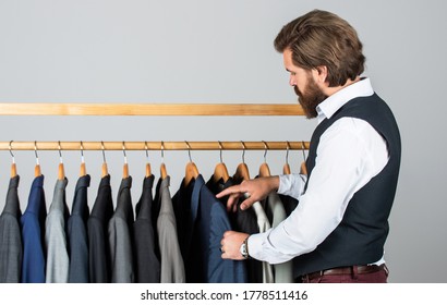 What Design Is Better. Businessman. Confident Tailor Designing Male Jacket. Handsome Sartor With Tape Measure. Male Beauty And Fashion. Bearded Man Tailoring Clothes. Formal And Office Wardrobe.