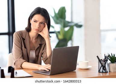 What To Do. Puzzled confused woman thinking hard concerned about problem solution looking aside, using laptop, copyspace - Shutterstock ID 1642800313