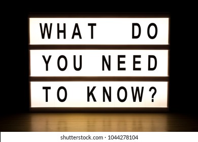 What Do You Need To Know Light Box Sign Board On Wooden Table. 