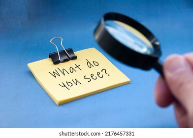 What Do You See Text On Yellow Notepad With Magnifying Glass On Blue Background. Fact Finding Concept