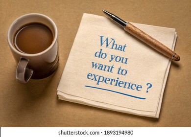 What Do You Want To Experience? Inspirational Question On A Napkin With A Cup Of Coffee. Planning And Goal Setting Concept.