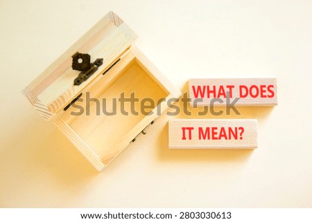What does it mean symbol. Concept words What does it mean on beautiful wooden blocks. Beautiful white background. Empty wooden chest. Business What does it mean motivational support concept Copy space