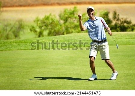 What an eagle. Full length shot of a golfer celebrating a great shot.