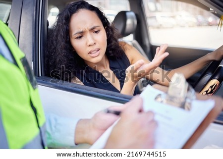 What exactly did I do wrong. Shot of a young businesswoman looking upset at receiving a ticket from a traffic officer.