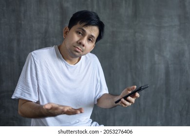 What Happened, Asian Man Looking At Smartphone In A Bad Mood Technological Intelligence Internet Outage