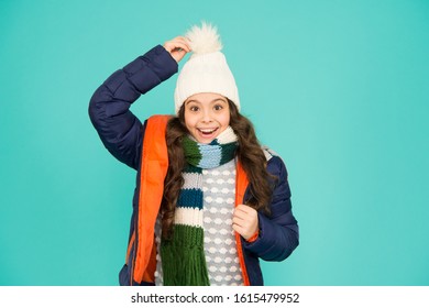 What a hat. Happy child wear warm hat. Little girl smile in pompom hat. Fashion accessory for winter. Fashion and style. Warm and stylish hat for cold weather.