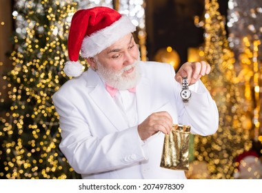 What Is Inside. New Year Gift For Men. Luxury And People Concept. Happy Man With Watch Illuminated Background. Santa Businessman Has Wristwatch Present. Elite And Expensive Gift