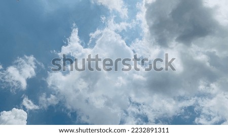 What makes stratocumulus clouds unique rather lumpy appearance at cloud base and lighter regions at Bangkok, Thailand. no focus