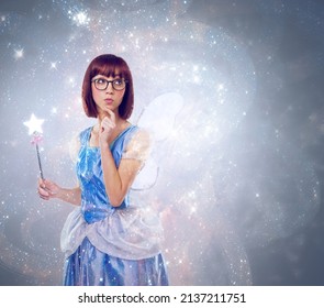 What wish should I grant next. A cropped shot of a fairy godmother in a blue gown.