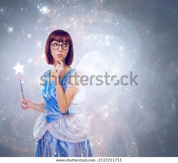What wish should I grant next. A cropped shot\
of a fairy godmother in a blue\
gown.