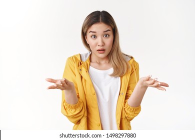 What Wrong. Ambushed Shocked Confused Young Asian Girl Coworker Shrugging Hands Spread Sideways Full Disbelief Asking Question Questioned Perplexed Understood Situation, White Background