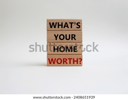 What is your home worth symbol. Wooden blocks with words What is your home worth. Beautiful white background. Business and What is your home worth concept. Copy space.