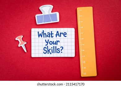 What Are Your Skills. Teaching And Office Items On A Red Background.