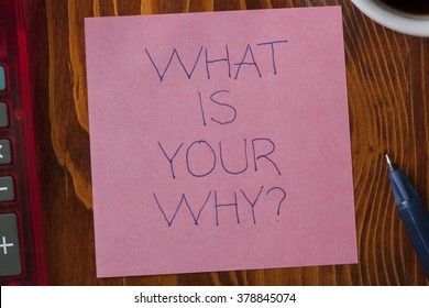 What Is Your Why Written On A Note On Wooden Background With Pen.