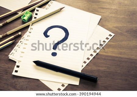 What's Your Story, Question Mark on papers with many pencils
