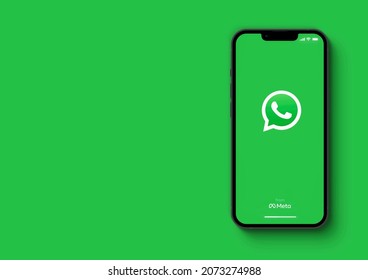 WhatsApp app from Meta on smartphone iPhone 13 Pro screen on green background. Rio de Janeiro, RJ, Brazil. November 2021.