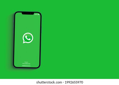 WhatsApp App On The Smartphone Screen On Green Background. Rio De Janeiro, RJ, Brazil. June 2021.