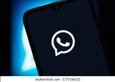 Whatsapp Logo Display On A Smartphone With A Dark Background. JUL 16, 2020: Bangalore, India.
