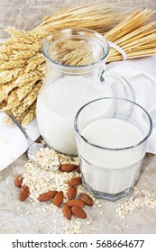Wheat and almond ecological milk with cereals on vintage background