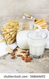 Wheat and almond ecological milk with cereals on vintage background