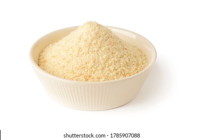 Wheat bread crumbs in a beige ceramic bowl isolated on white background. Ingredient for meatballs and cutlets. Cook at home. Front view.