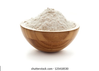 wheat flour in wooden bowl