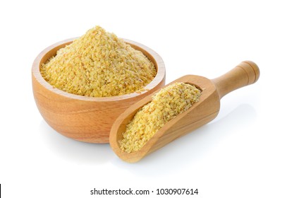 Wheat germ in wood bowl and scoop on white background