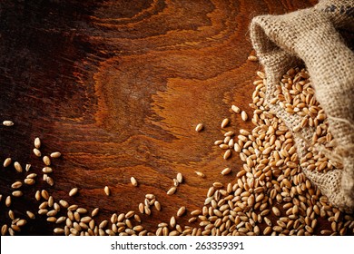 Wheat Grain On Wooden Table